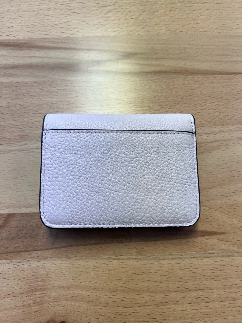 kate spade Light Pink Pebbled Leather wallet with Gold Logo